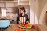 a woman cooking in the kitchen