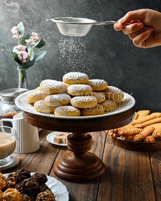 Dusting the eid cookies with icing sugar
