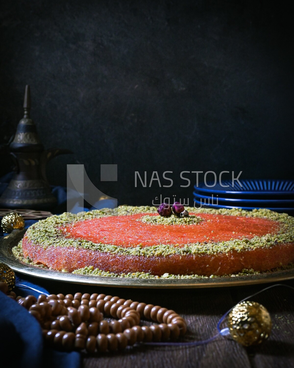 Plate of palestine knafeh with some nuts on it