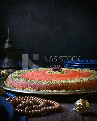 Plate of palestine knafeh with some nuts on it