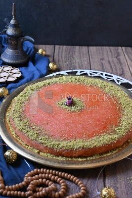 Plate of palestine knafeh with some nuts on it