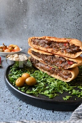 dish with hawawshi on it with fries.
