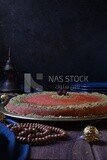 Plate of palestine knafeh with some nuts on it