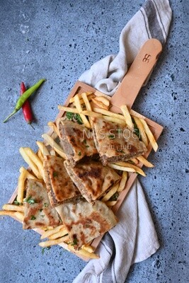 dish with hawawshi on it with fries