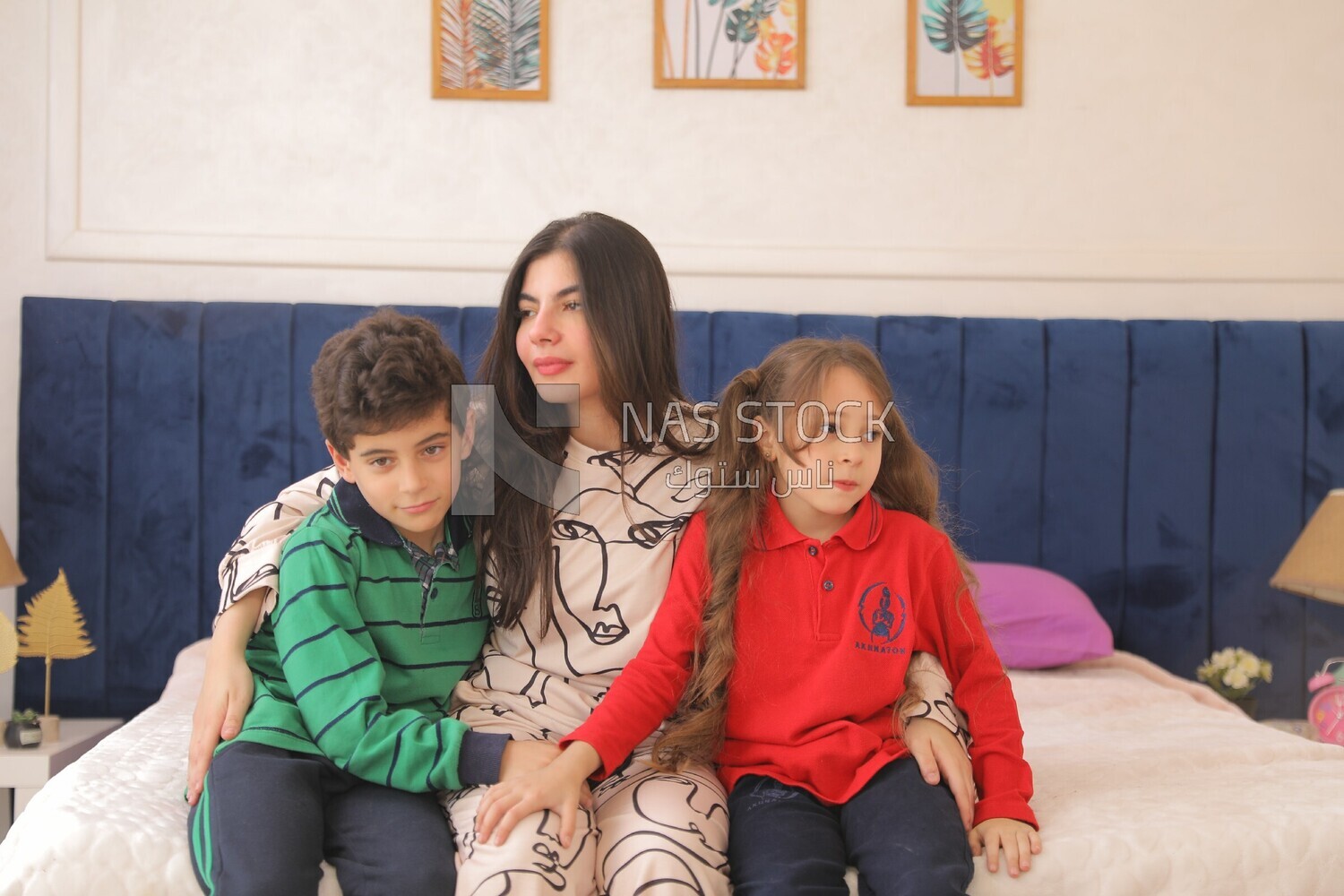 a mother hugging her kids before going to the school