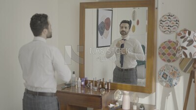 a man standing in front of a mirror wearing a jacket