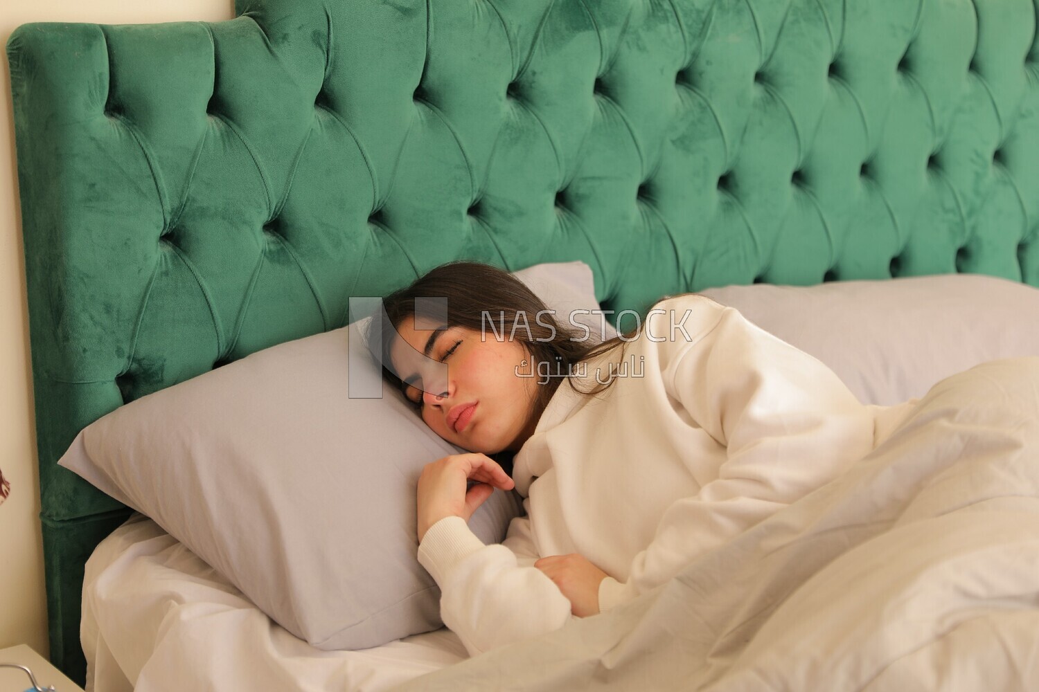 a woman sleeping in bed