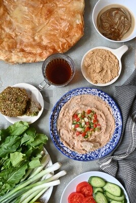 Egyptian breakfast with a cup of tea on the table