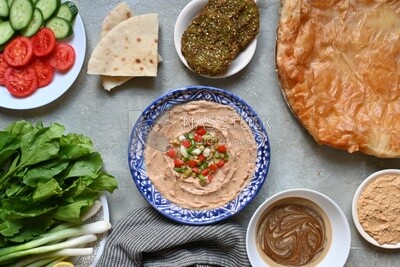 Feeter meshaltet with honey, cheese, and bread