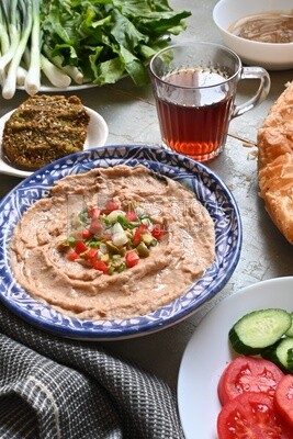 Egyptian breakfast with a cup of tea on the table