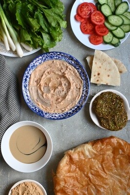 Feeter meshaltet with honey, cheese, and bread
