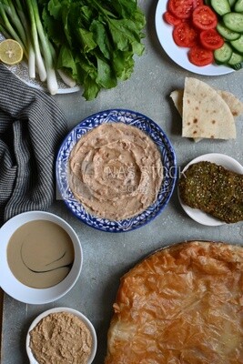 Feeter meshaltet with honey, cheese, and bread