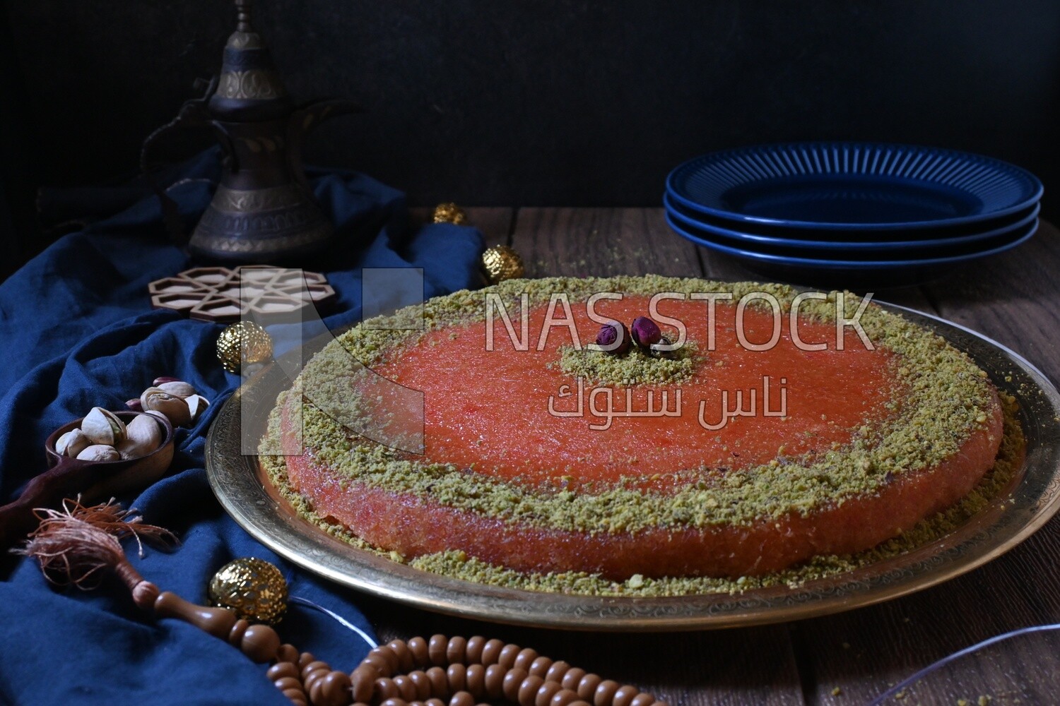 Plate of palestine knafeh with some nuts on it