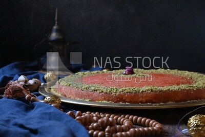 Plate of palestine knafeh with some nuts on it
