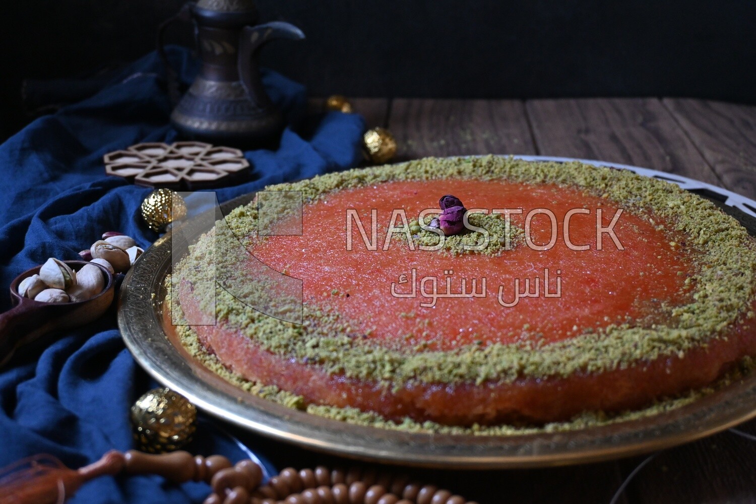Plate of palestine knafeh with some nuts on it