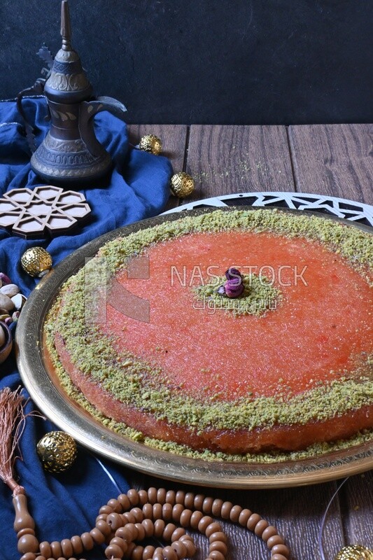 Plate of palestine knafeh with some nuts on it
