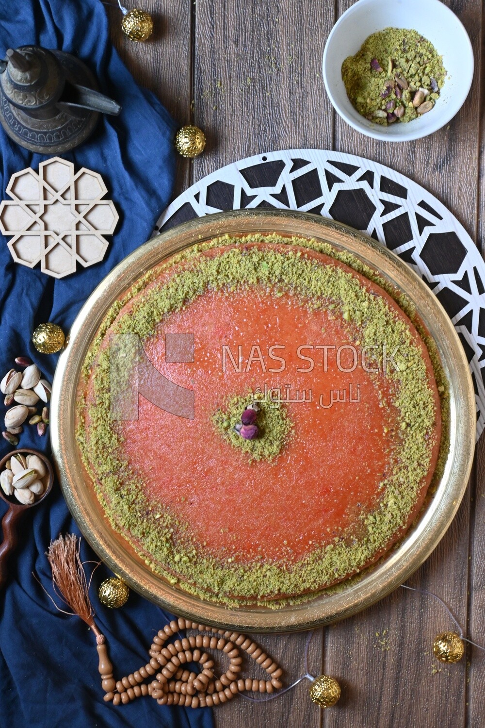 Plate of palestine knafeh with some nuts on it