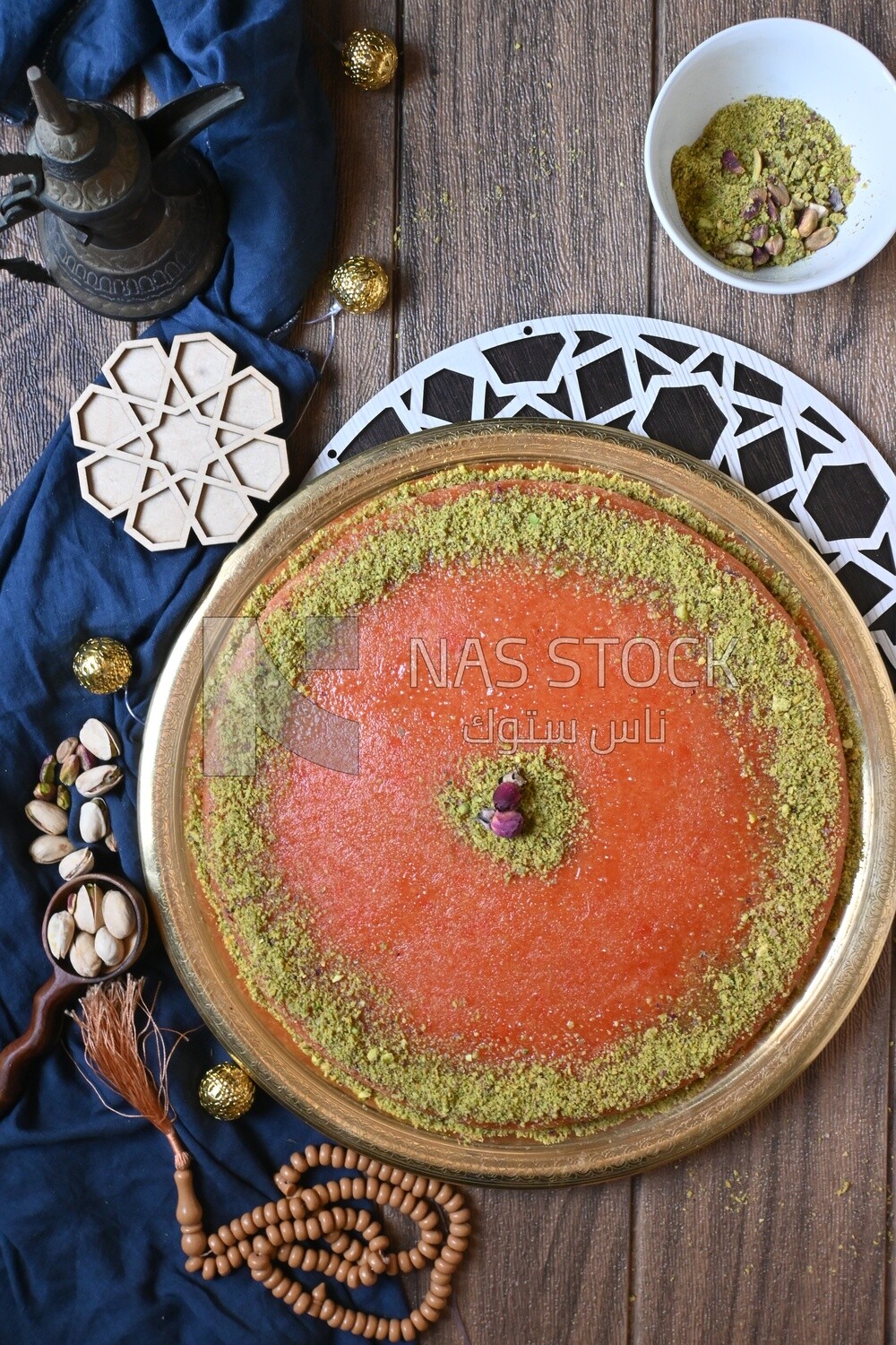 Plate of palestine knafeh with some nuts on it