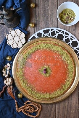 Plate of palestine knafeh with some nuts on it