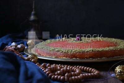 Plate of palestine knafeh with some nuts on it