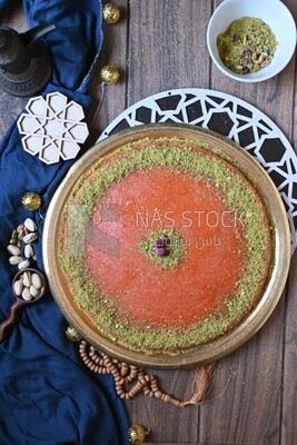 Plate of palestine knafeh with some nuts on it
