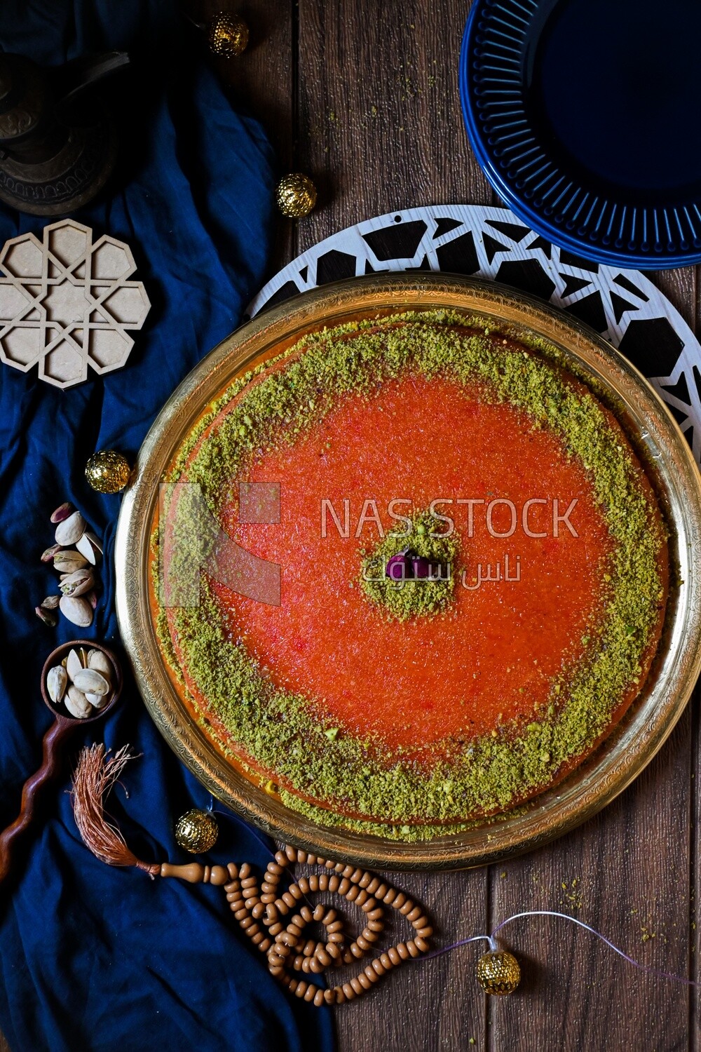 Plate of palestine knafeh with some nuts on it