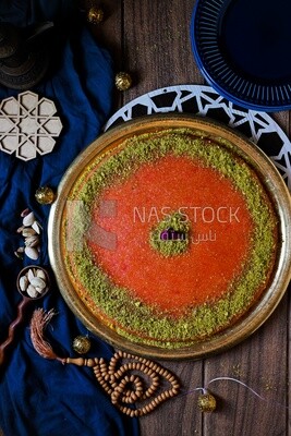 Plate of palestine knafeh with some nuts on it