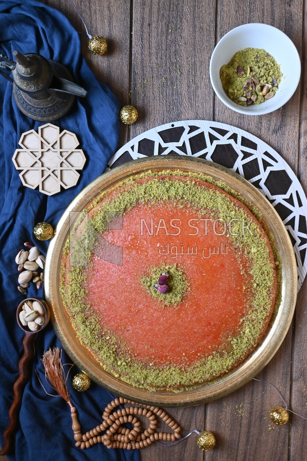 Plate of palestine knafeh with some nuts on it
