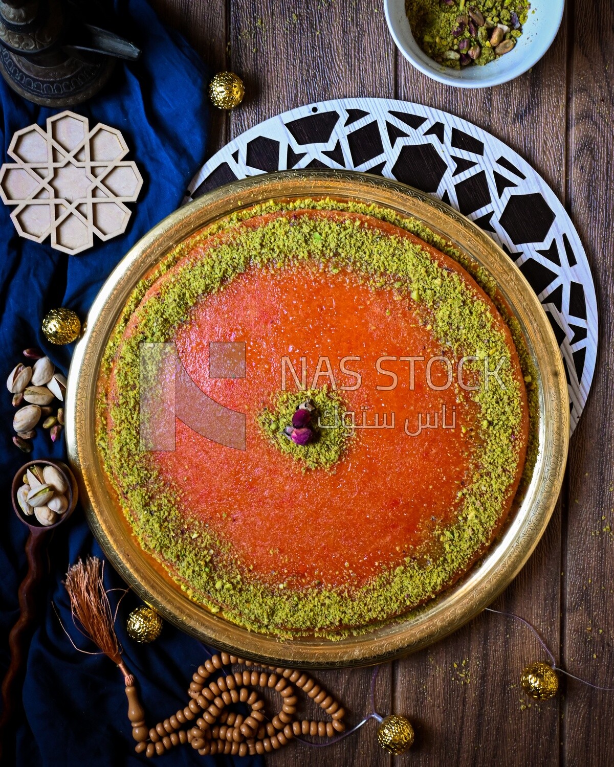 Plate of palestine knafeh with some nuts on it