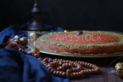 Plate of palestine knafeh with some nuts on it