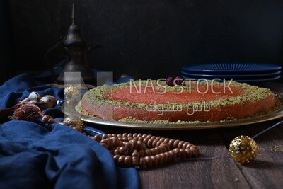 Plate of palestine knafeh with some nuts on it