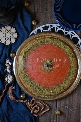 Plate of palestine knafeh with some nuts on it
