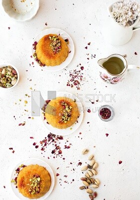 Plate of palestine knafeh with some nuts on it