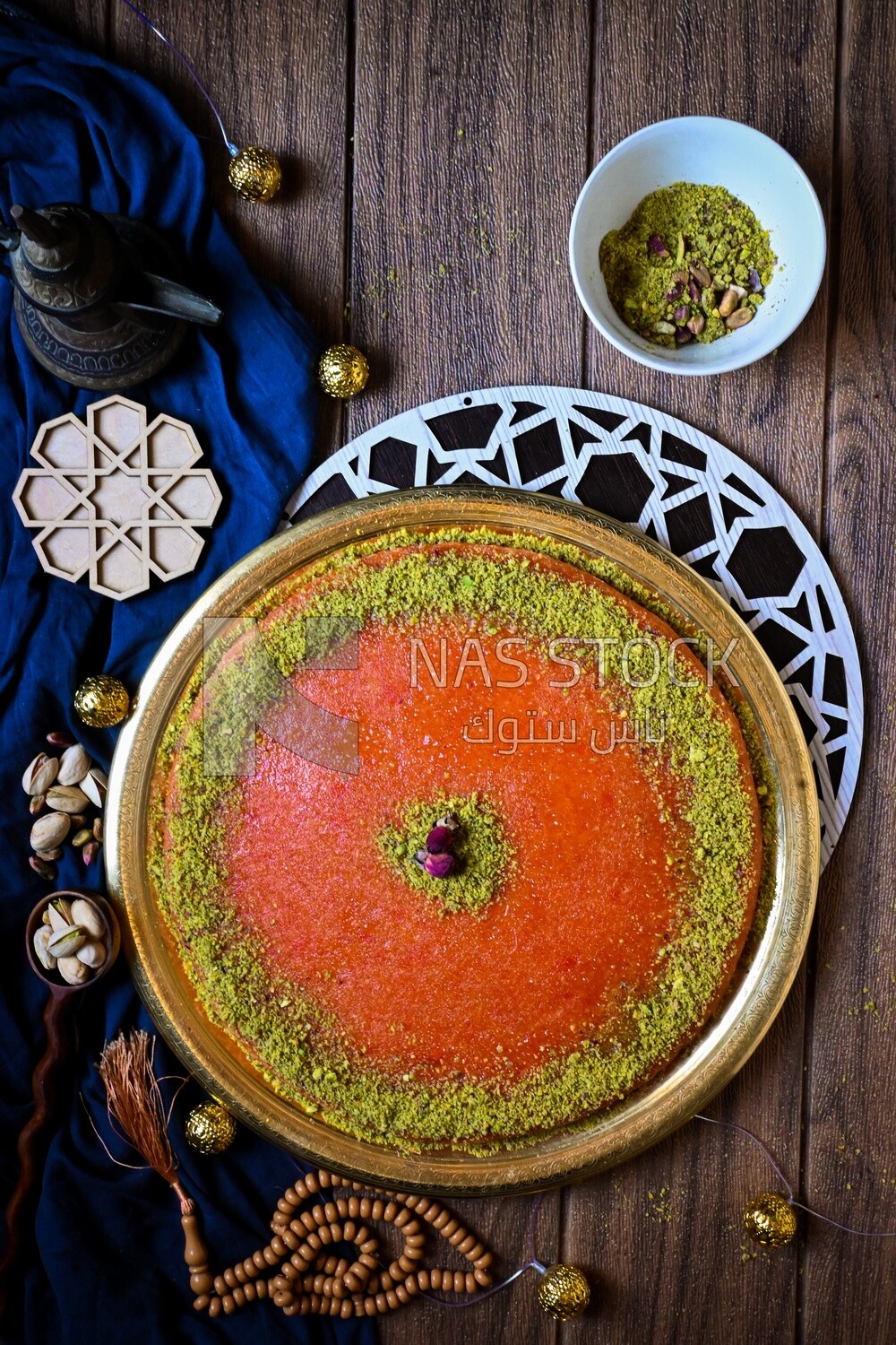 Plate of palestine knafeh with some nuts on it