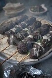 Dish with grilled kofta with tahini sauce on it