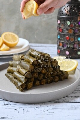 Hand squeezed lemon on grape leaves