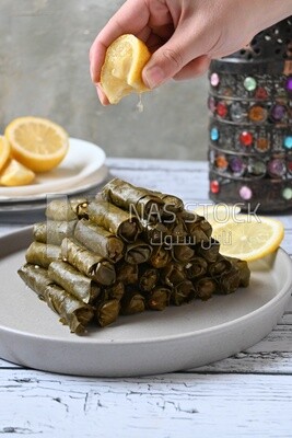 Hand squeezed lemon on grape leaves