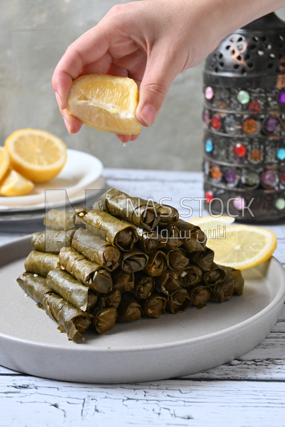 Hand squeezed lemon on grape leaves