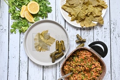Grape leaves with lemon and ingredients