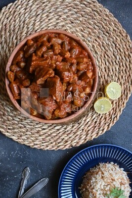 Top view of a delicious okra dish with sauce and meat, Plate rice, Arabic meals, recipes and delicious food dishes, delicious meals, delicious food, okra dish