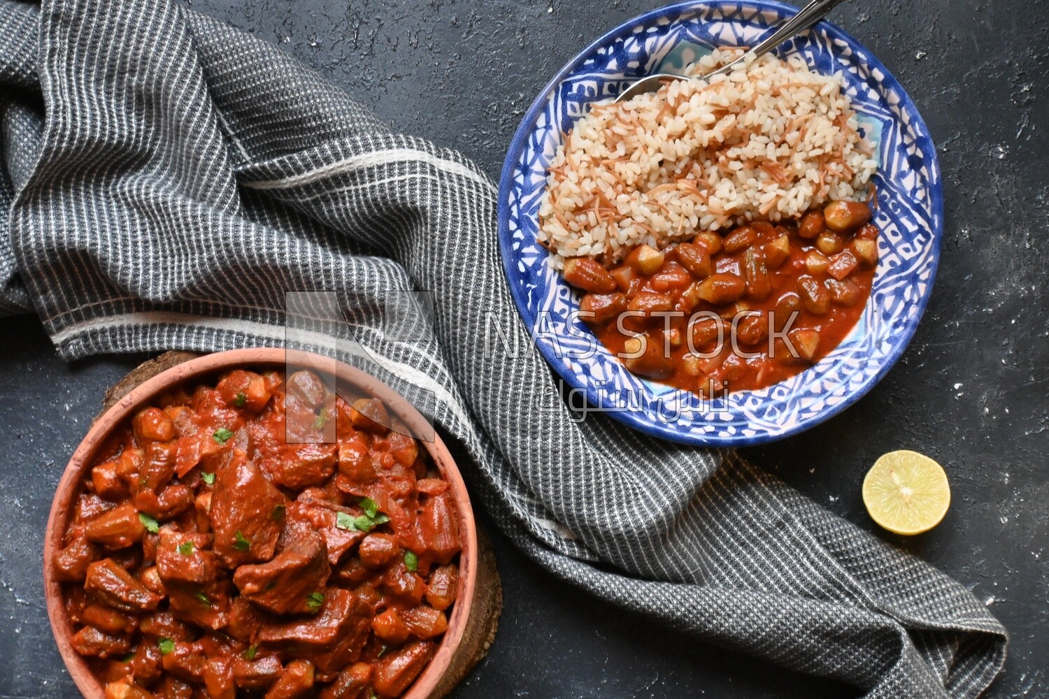 Top view of a delicious okra dish with sauce and meat, Plate rice, Arabic meals, recipes and delicious food dishes, delicious meals, delicious food, okra dish