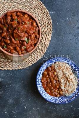 Top view of a delicious okra dish with sauce and meat, Plate rice, Arabic meals, recipes and delicious food dishes, delicious meals, delicious food, okra dish