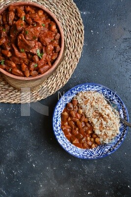 Top view of a delicious okra dish with sauce and meat, Plate rice, Arabic meals, recipes and delicious food dishes, delicious meals, delicious food, okra dish