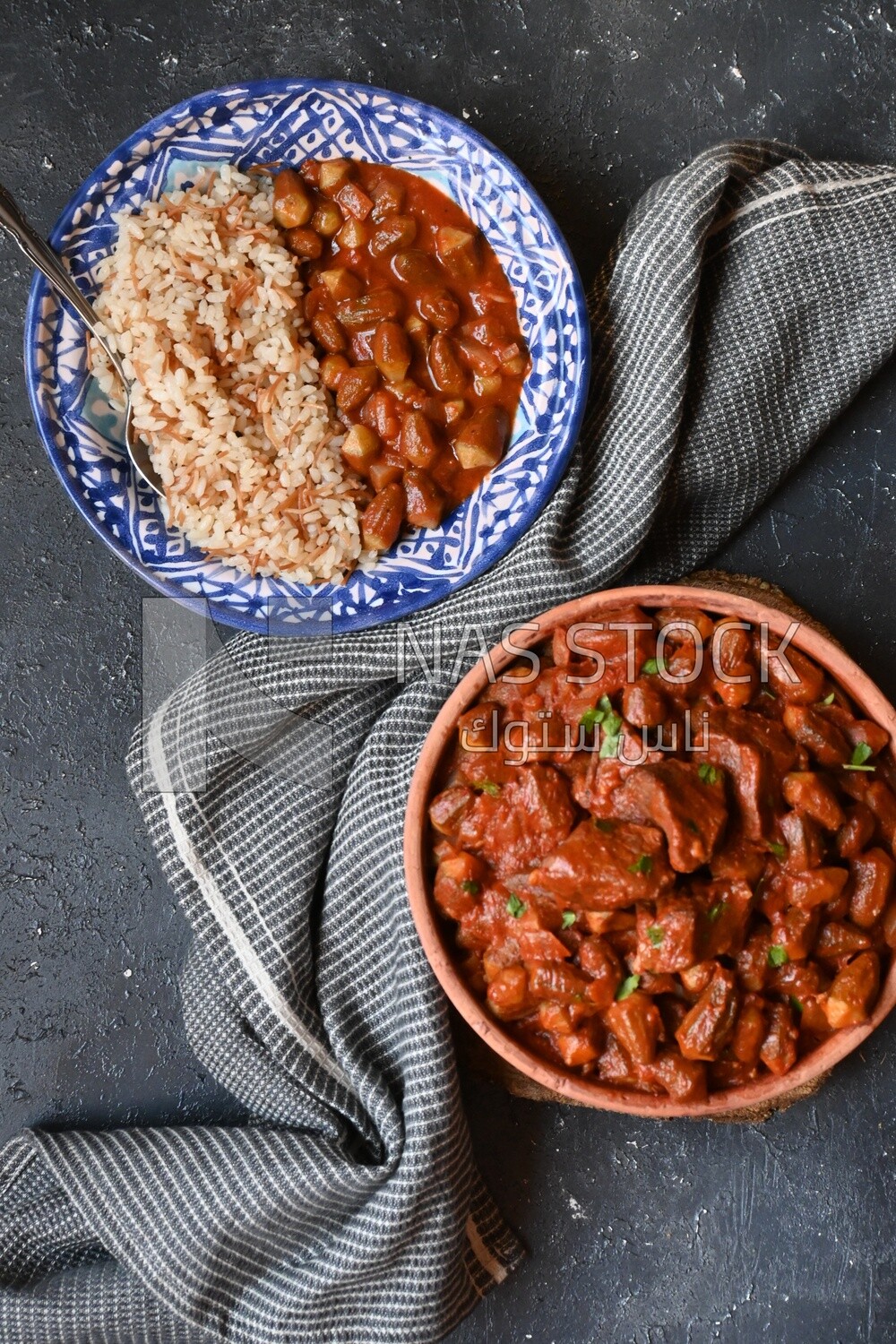 Top view of a delicious okra dish with sauce and meat, Plate rice, Arabic meals, recipes and delicious food dishes, delicious meals, delicious food, okra dish