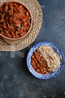 Top view of a delicious okra dish with sauce and meat, Plate rice, Arabic meals, recipes and delicious food dishes, delicious meals, delicious food, okra dish