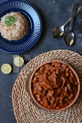 Top view of a delicious okra dish with sauce and meat, Plate rice, Arabic meals, recipes and delicious food dishes, delicious meals, delicious food, okra dish