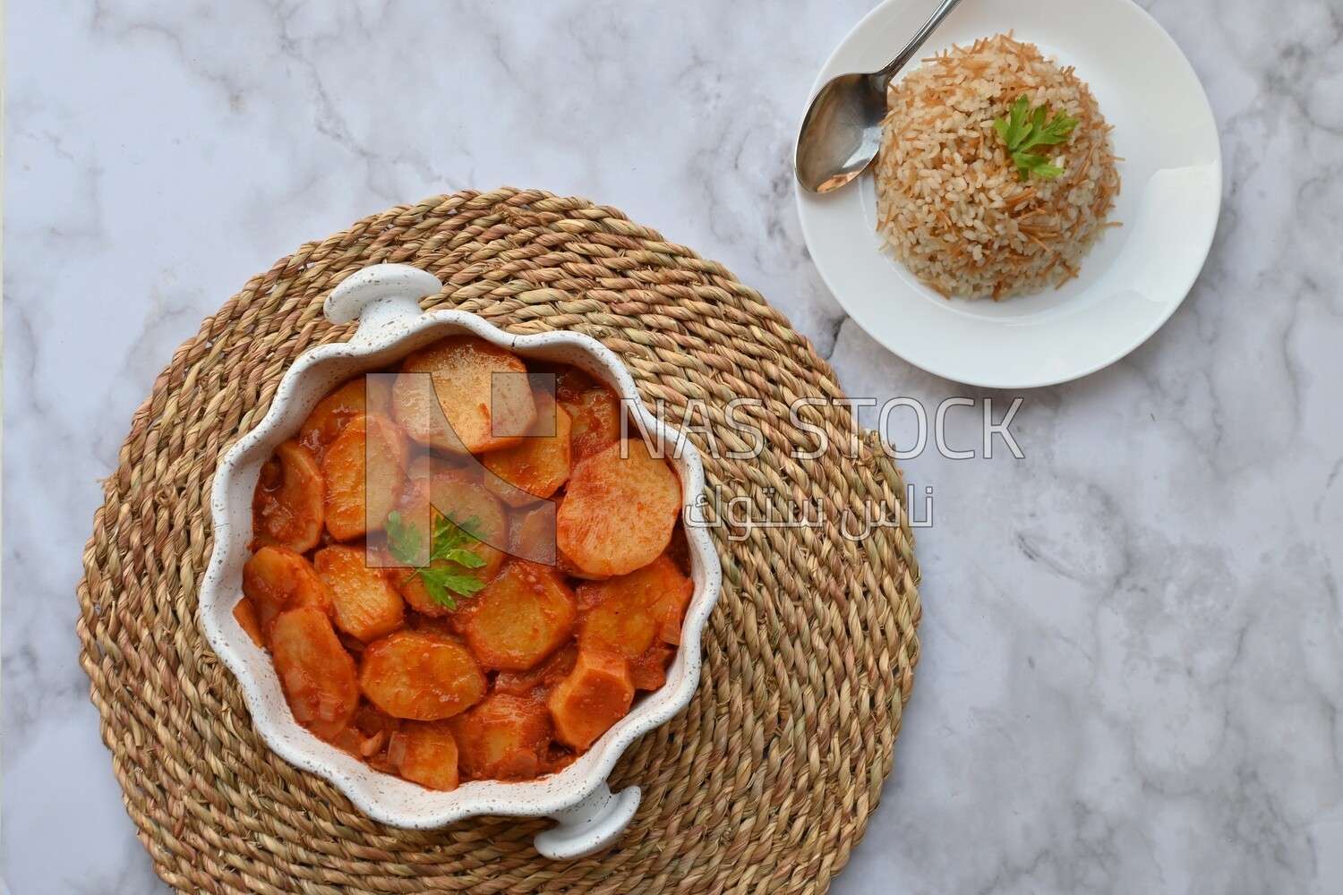 Potato tray sits beside a plate of rice