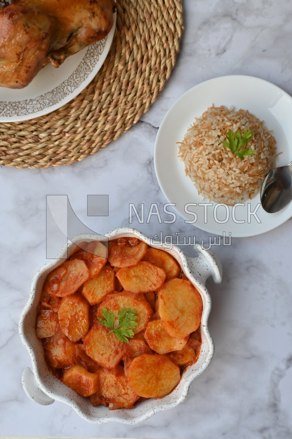 Potato tray sits beside a plate of rice