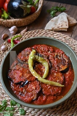Plate of egyptian mesaka with green pepper on it.