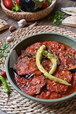 Plate of egyptian mesaka with green pepper on it.
